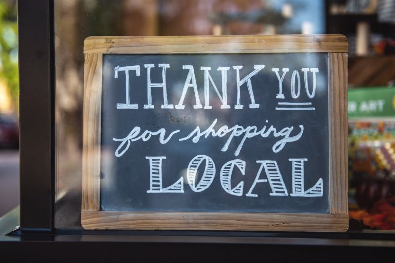 sign that says "thank you for shopping local" symbolizing review responses for improving SEO for small business